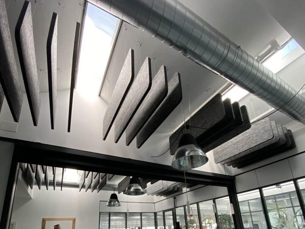 Acoustic Absorption Suspended acoustic absorbers used to reduce reverberation and control mid- to high-frequency reflections in open architectural spaces.