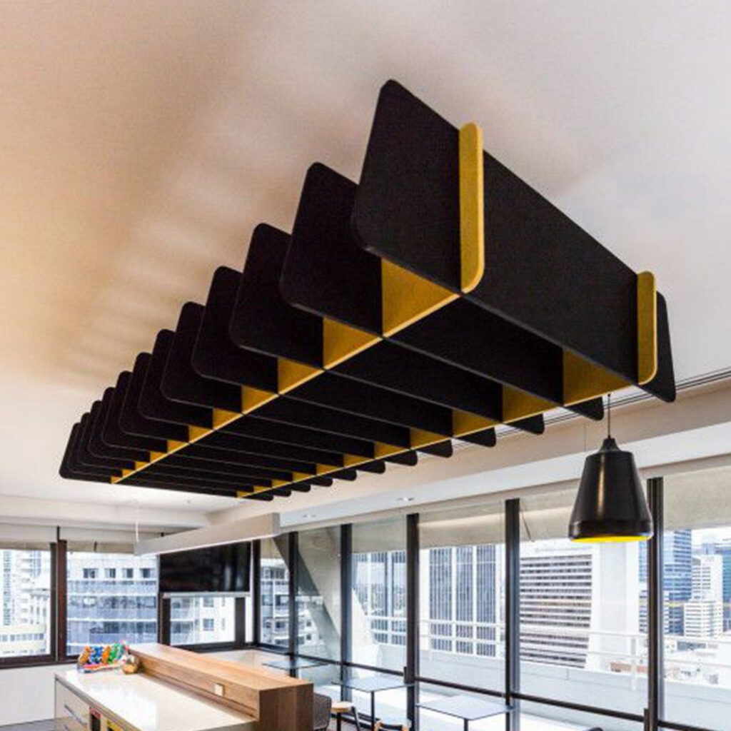 Acoustic Absorption Architectural acoustic baffles integrated into occupied spaces to manage reverberation while preserving spatial functionality and aesthetics.